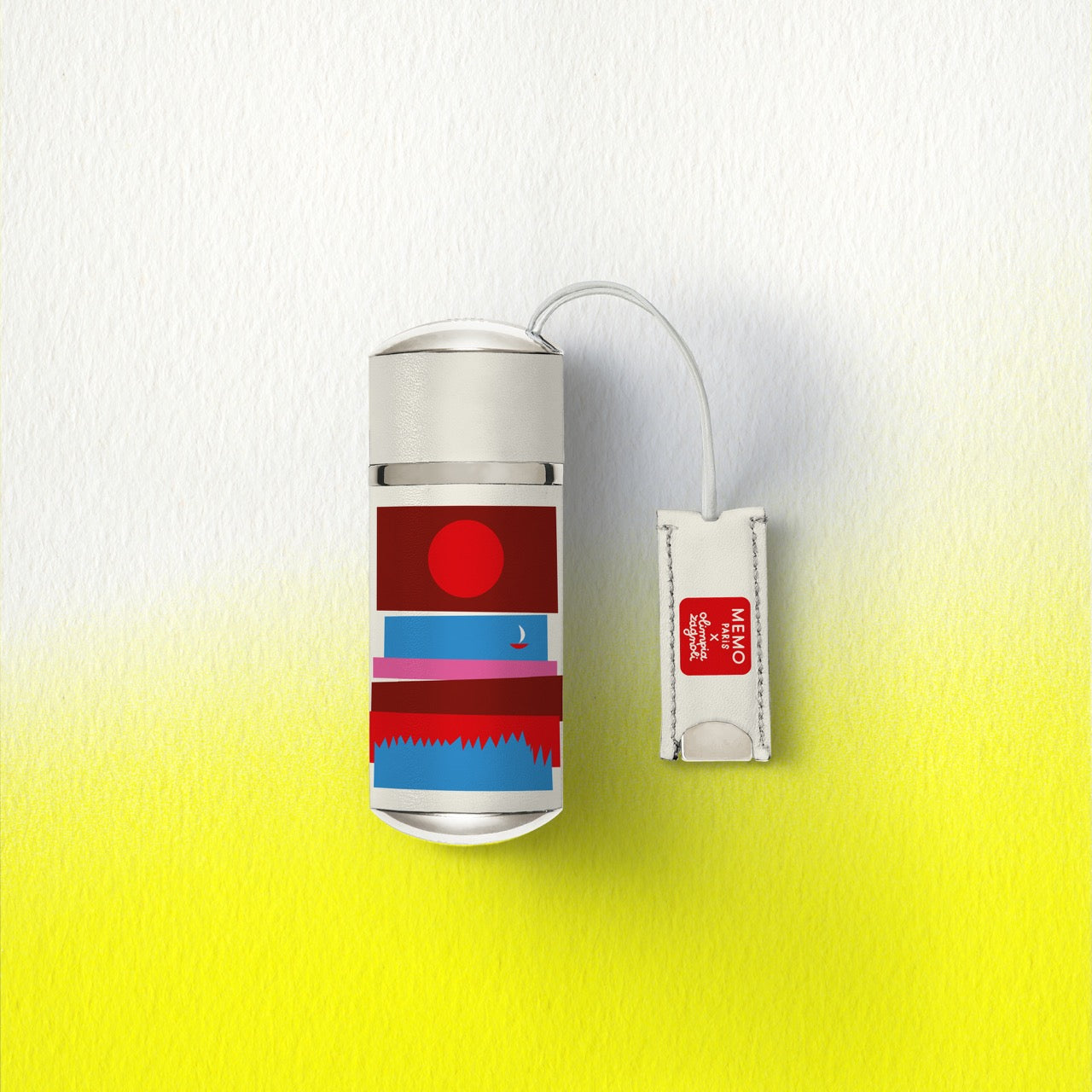 A sleek silver memo paris usb flash drive with colorful red blue and pink bands from the cap camarat collection