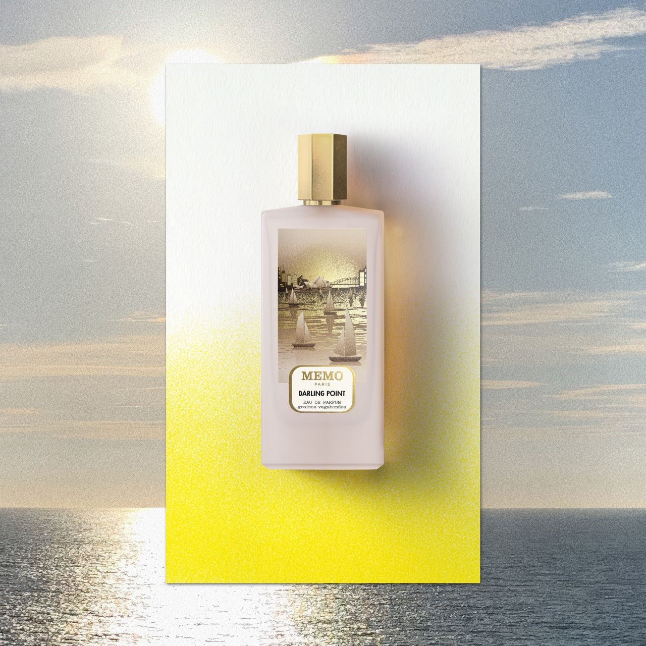 A pale pink rectangular perfume bottle with gold cap and sailboat label by memo paris for darling point australian encounter